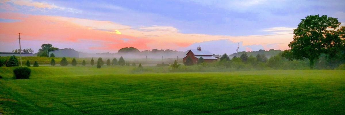 A colorful sunset behind our barn